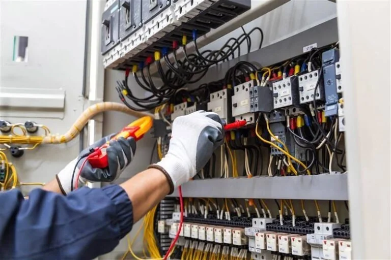 Electrician testing circuit breaker panel – Mr.Helper electrical service