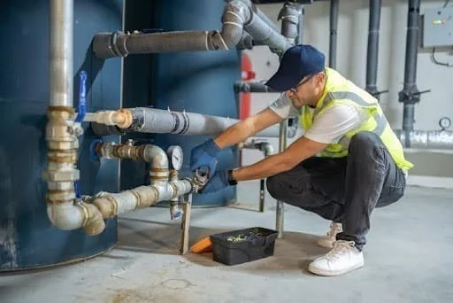 Plumber fixing water pipes and valves – Mr.Helper plumbing service